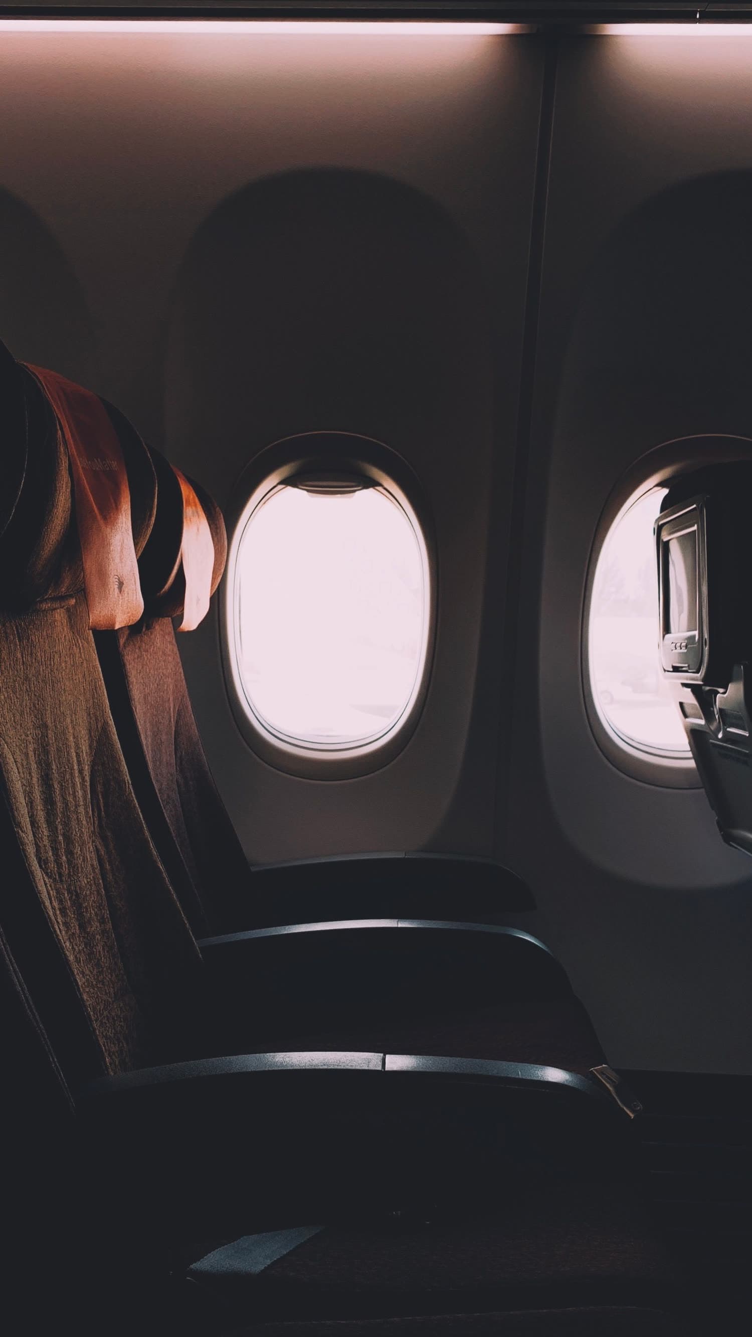 Window seats on a flight at dusk